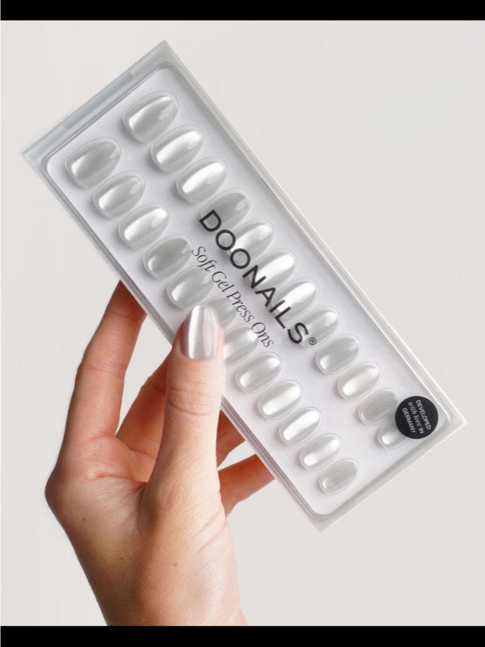 DooNails Soft Gel Press Ons in “White Cateye,” short round